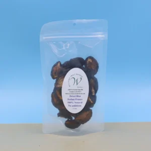 Natural dried plums, blue background